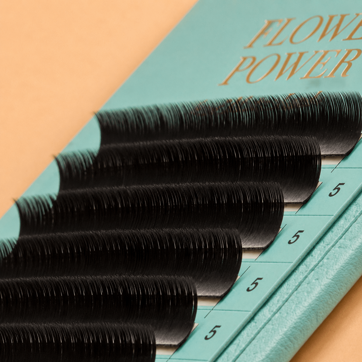 Front packaging view of the Flower Power True Matte deep black lash extension 18-line acrylic tray.