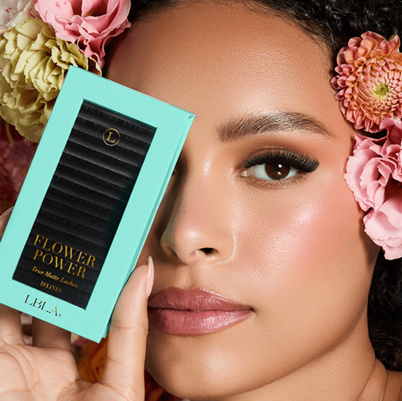 Clear acrylic lid view of the Flower Power True Matte lash tray showing organized black lash strips.